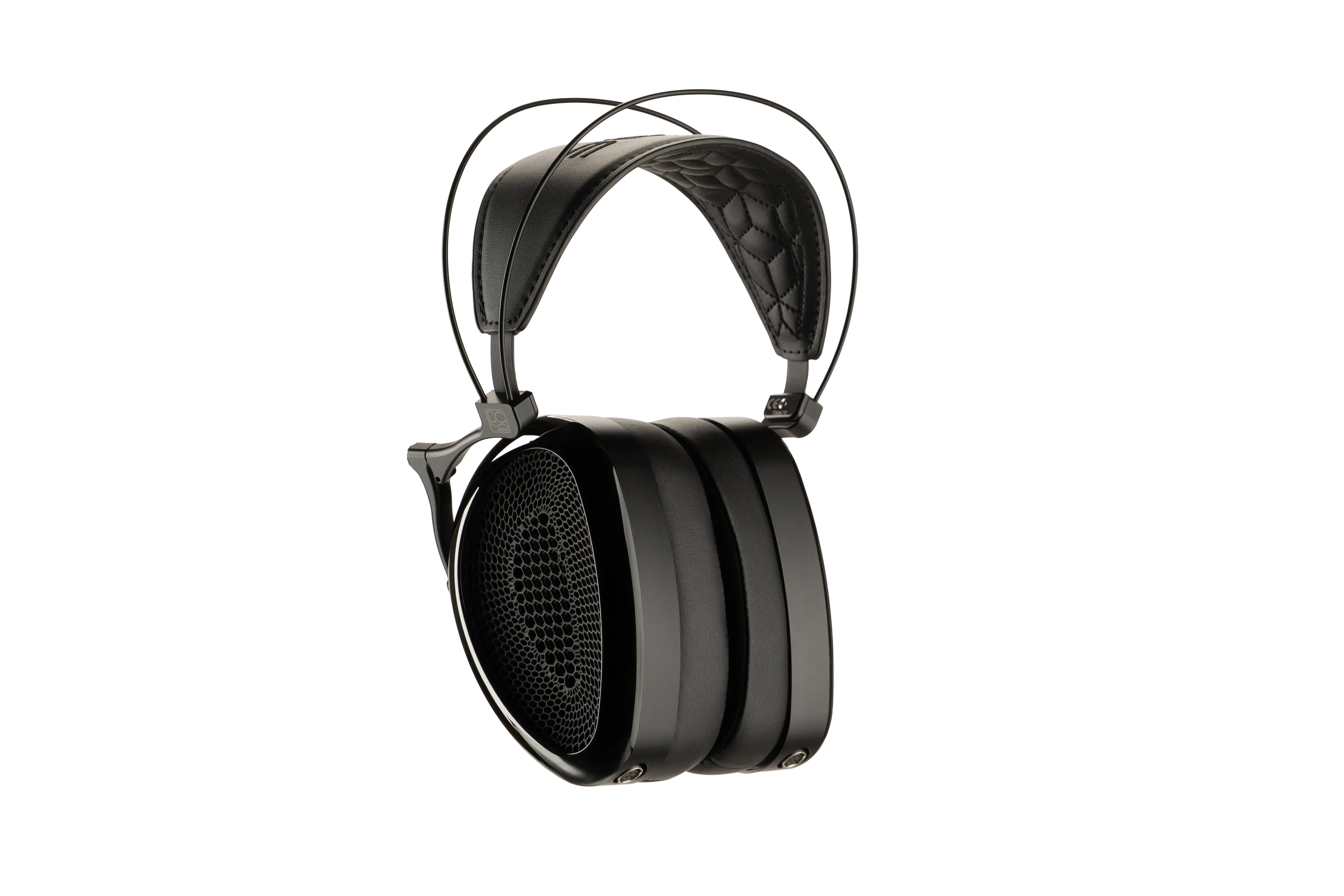 Black Audeze MM-500 headphones with a quilted leather headband, metal frame, and large earcups with a honeycomb design. Close-up, side view.