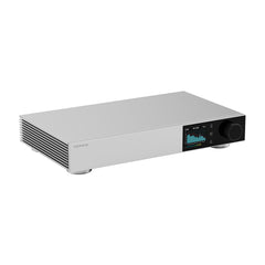 Silver audio amplifier with digital display on a white background