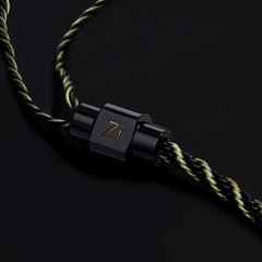 Black metal clasp with 'Zi' branding on a braided cord against a dark background